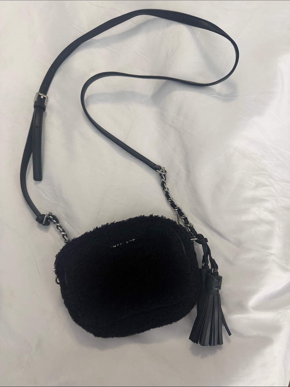 Michael Michael Kors Small Chain Black Shearling Crossbody Bag with Tassel.